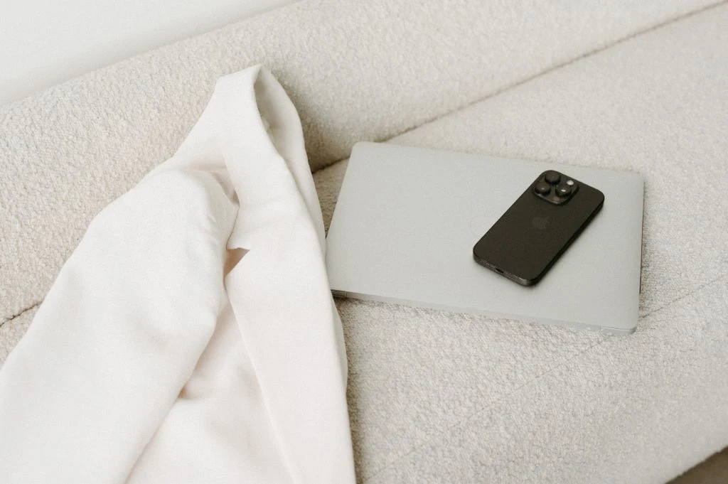 Luxury flatlay with blazer, laptop and phone